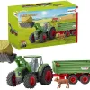 Boite de jeux schleich farm world tracteur convoyeur a foin avec remorque